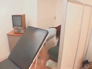 Asia patient cunt opened with speculum at the therapist